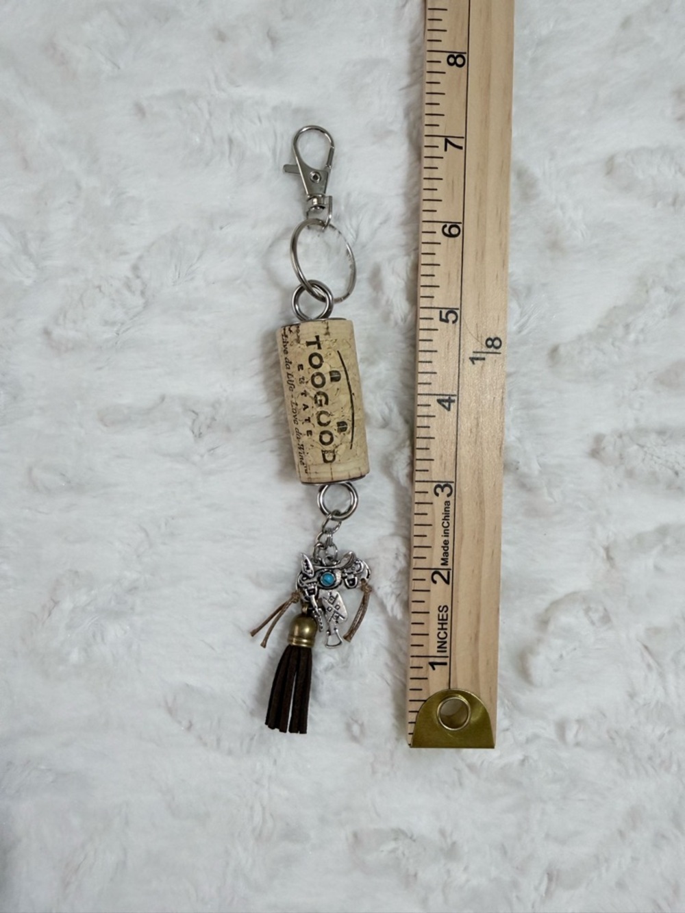 HandmadeBrown Tassel Silvertone Saddle with turquoise accent, wine cork keychain